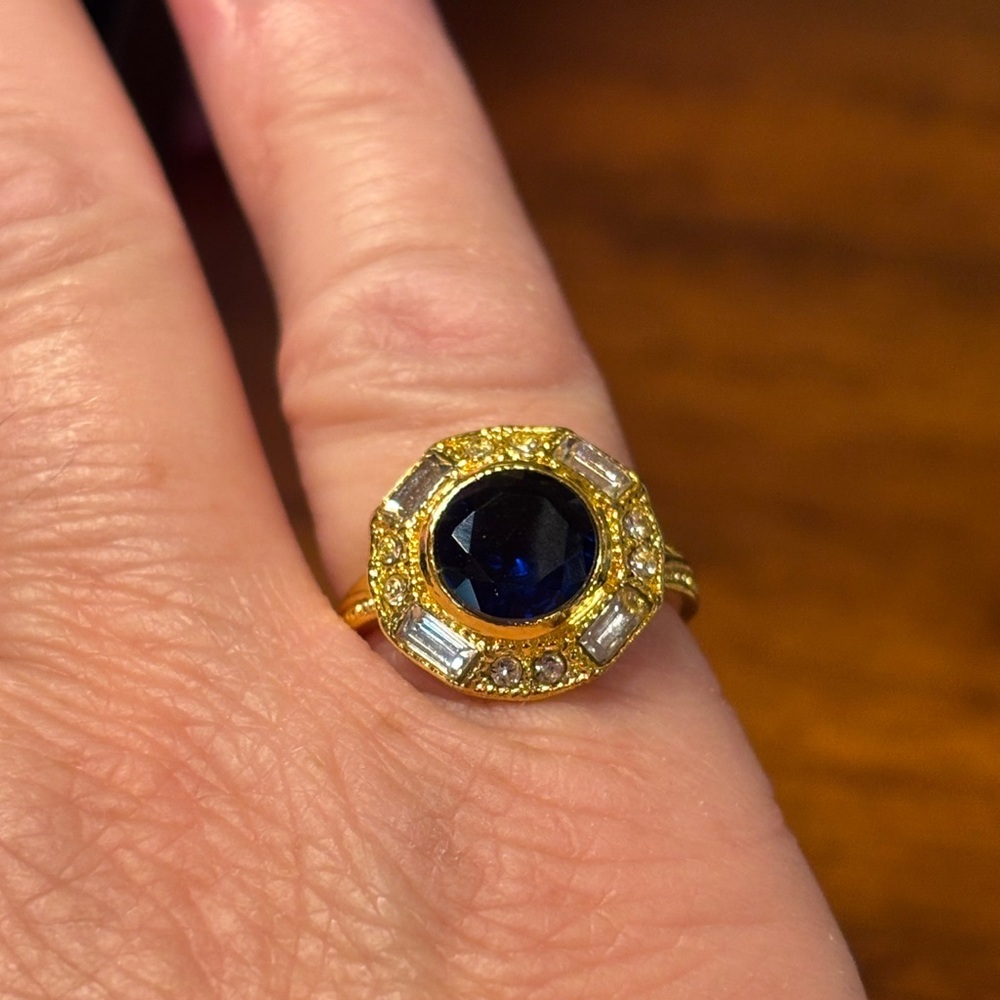 Gold Toned Ring with Deep Blue glass size Almost a size 6 see pictures